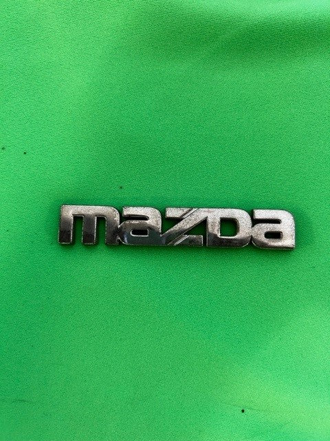 Genuine Mazda OEM Rear Bumper Emblem [Used]